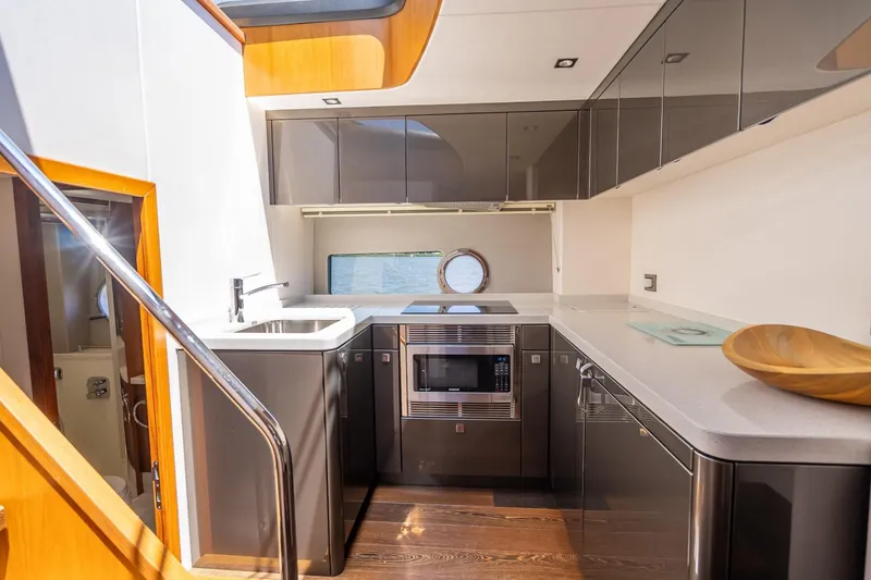 Slide: The Image of Luxurious kitchen interior of 2018 Sunseeker Predator 57 yacht with modern appliances. - 48