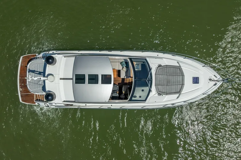 Slide: The Image of Overhead view of 2018 Sunseeker Predator 57 yacht cruising on green water. - 24