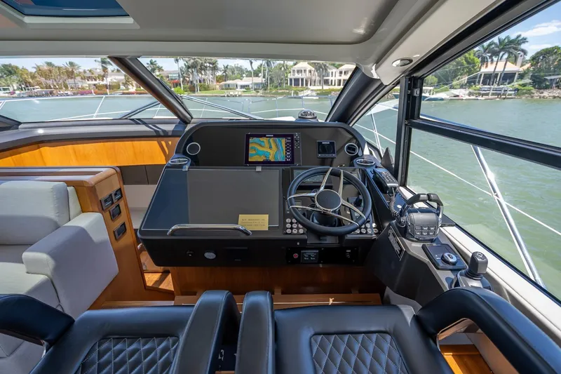 Slide: The Image of Luxurious helm of 2018 Sunseeker Predator 57 yacht with modern navigation equipment. - 61