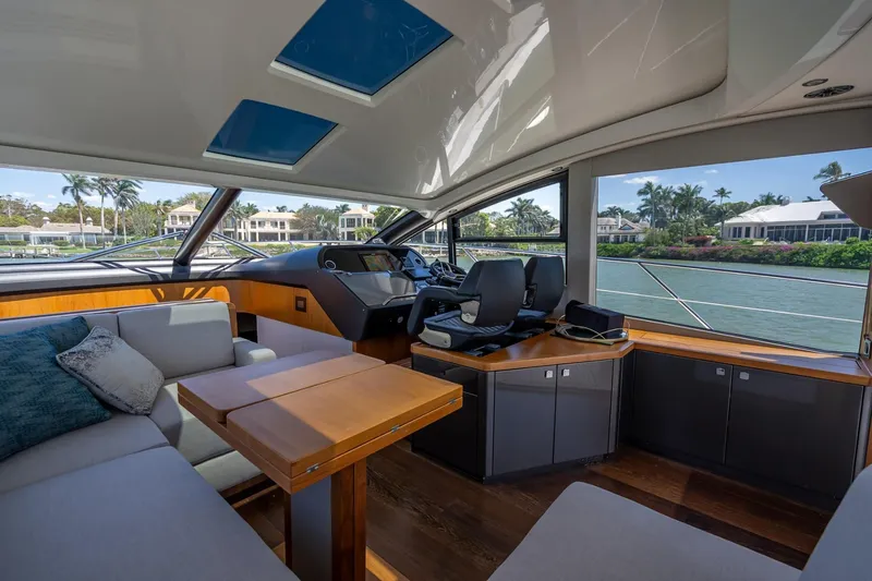 Slide: The Image of Luxurious interior of 2018 Sunseeker Predator 57 yacht with modern helm and seating area. - 56