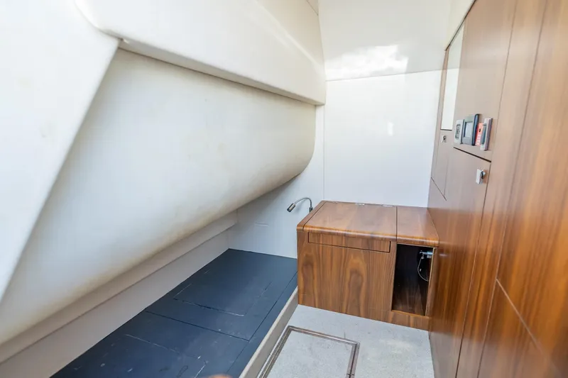 Slide: The Image of Interior of 2018 Sunseeker Predator 57 yacht, featuring sleek wood cabinetry and modern design. - 75