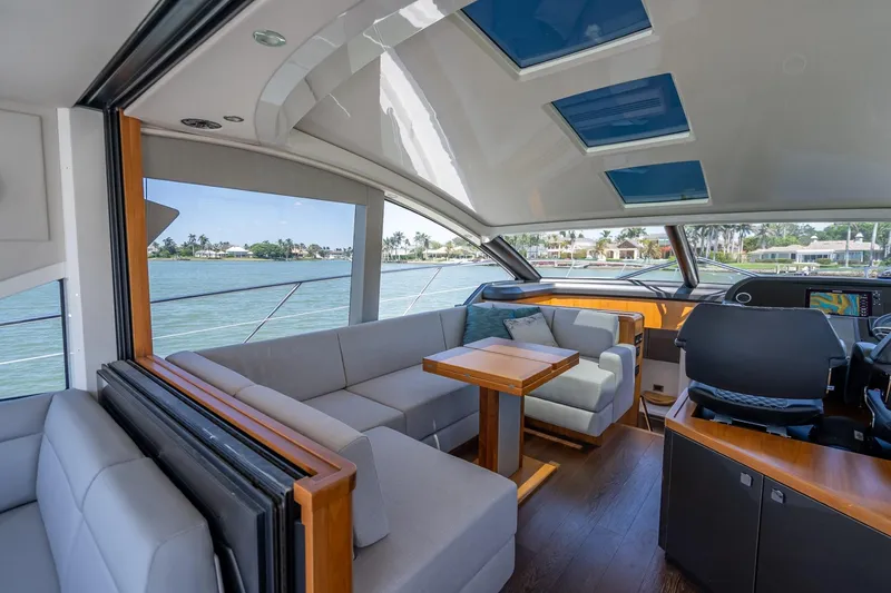 Slide: The Image of Luxurious interior of 2018 Sunseeker Predator 57 yacht with modern seating and panoramic views. - 52