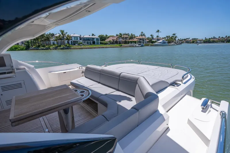 Slide: The Image of Luxurious 2018 Sunseeker Predator 57 yacht with spacious deck and waterfront view. - 27