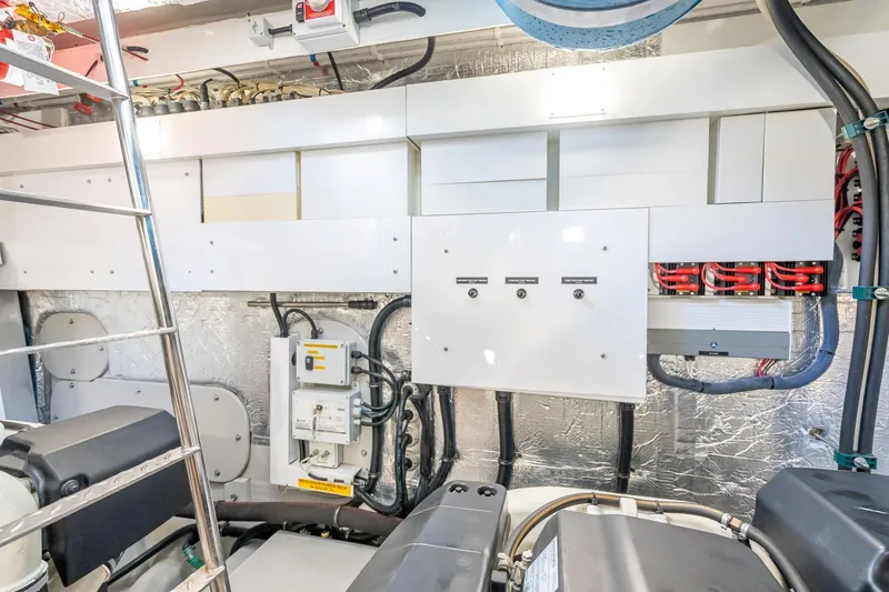 Slide: The Image of Engine room of 2018 Sunseeker Predator 57 yacht, showcasing electrical systems and components. - 87