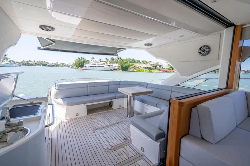 Slide: The Image of Luxurious 2018 Sunseeker Predator 57 yacht interior with spacious seating and scenic water view. - 33