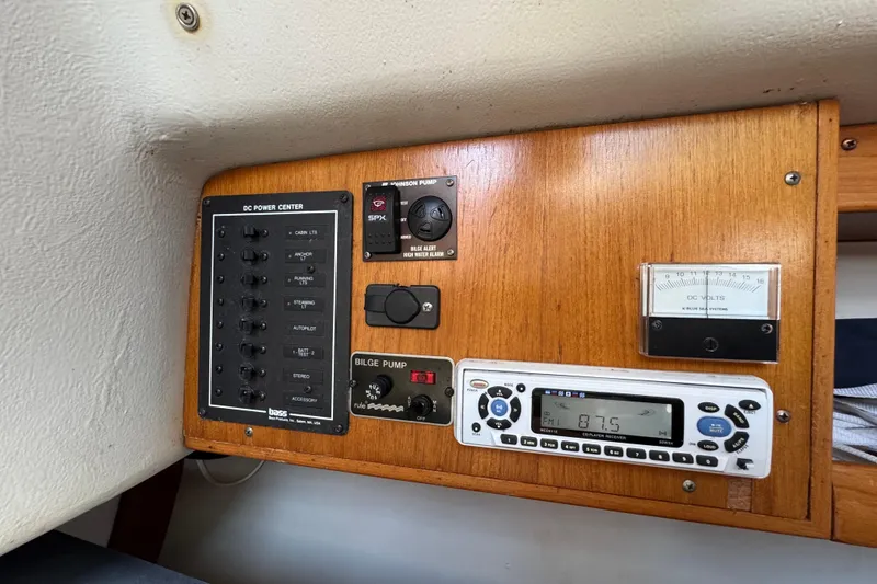 Slide: The Image of Control panel of a 2000 Alerion Express 28 sailboat with radio and voltmeter. - 16