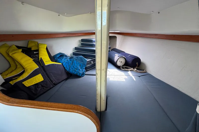 Slide: The Image of Interior of 2000 Alerion Express 28 sailboat with life jackets and cushions. - 18