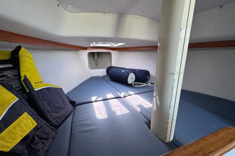 Slide: The Image of Interior cabin of 2000 Alerion Express 28 sailboat with life jackets and cushions. - 19
