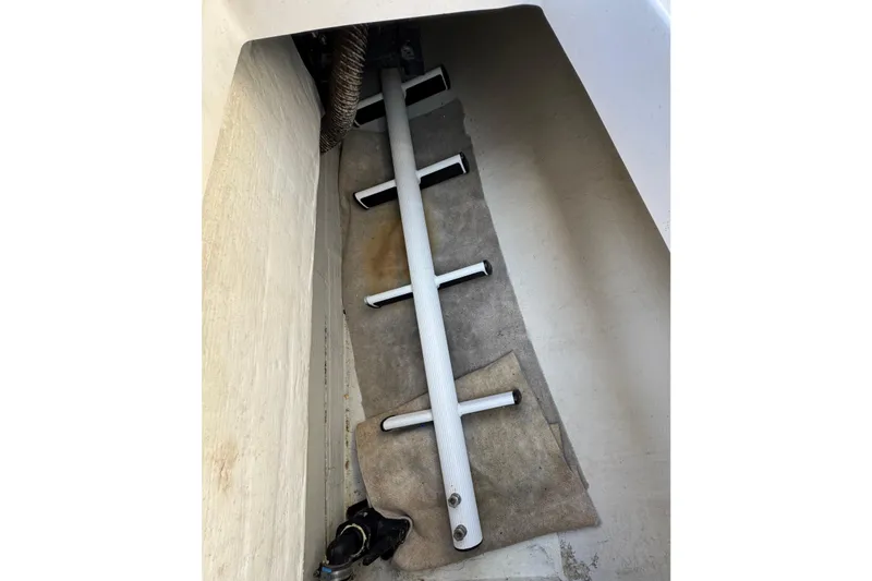 Slide: The Image of Interior view of a 2000 Alerion Express 28 sailboat, showcasing storage compartment details. - 22