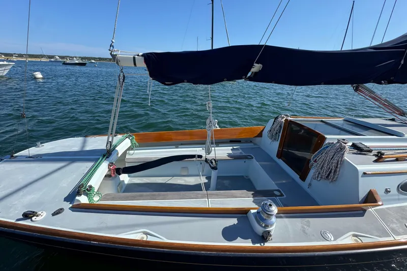 Slide: The Image of Sailboat Alerion Express 28, 2000 model, docked on calm waters under clear skies. - 3