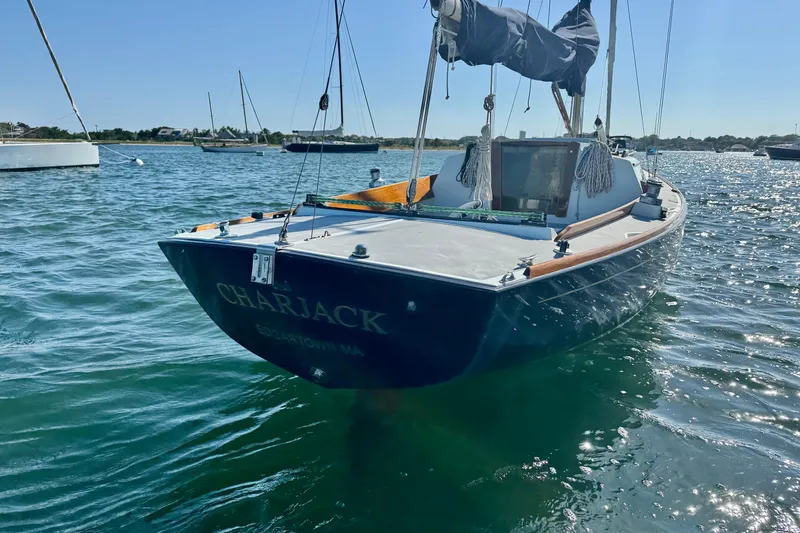 Slide: The Image of Alerion Express 28 sailboat, 2000 model, moored on a sunny day in clear waters. - 4