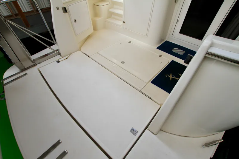 Slide: The Image of 2011 Fathom Element 43 yacht deck with storage compartments and non-slip mats. - 12