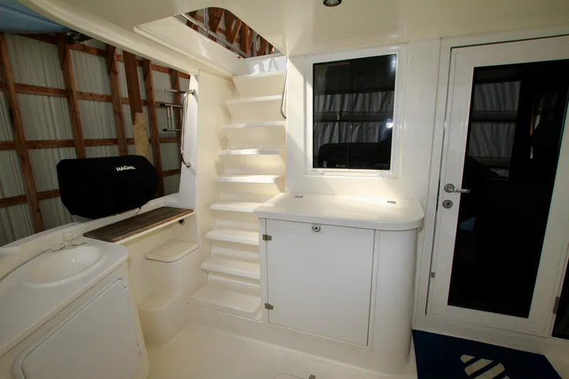 Slide: The Image of Interior of 2011 Fathom Element 43 boat with stairs and cabinetry. - 14