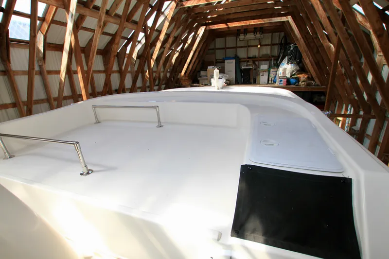 Slide: The Image of 2011 Fathom Element 43 boat in wooden storage shed. - 17