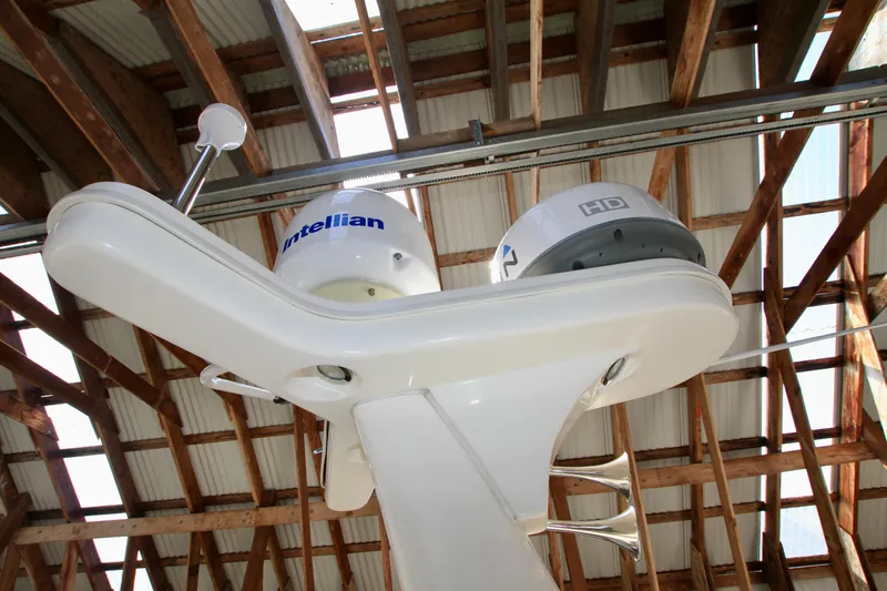 Slide: The Image of Radar and satellite equipment on a 2011 Fathom Element 43 boat under a wooden roof. - 18