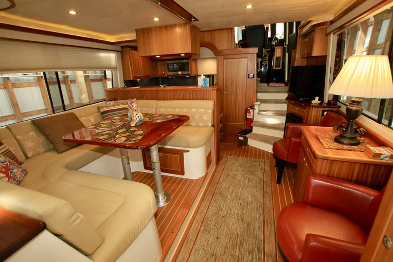 Slide: The Image of Luxurious interior of 2011 Fathom Element 43 yacht with elegant seating and wooden finishes. - 21