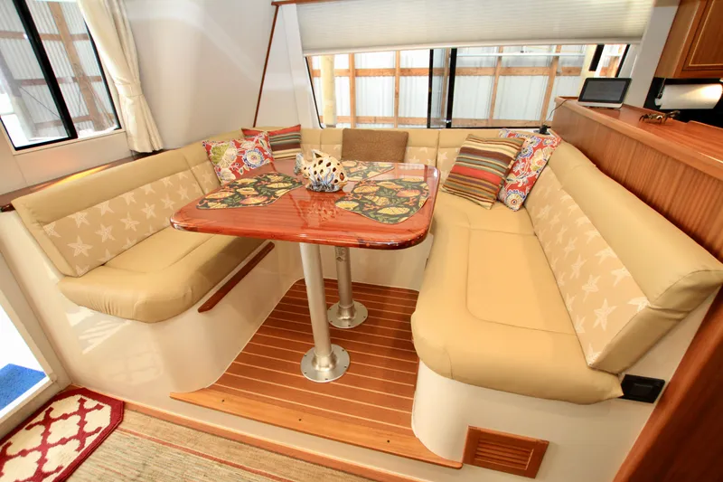 Slide: The Image of Luxurious 2011 Fathom Element 43 yacht interior with cozy seating and decorative pillows. - 22