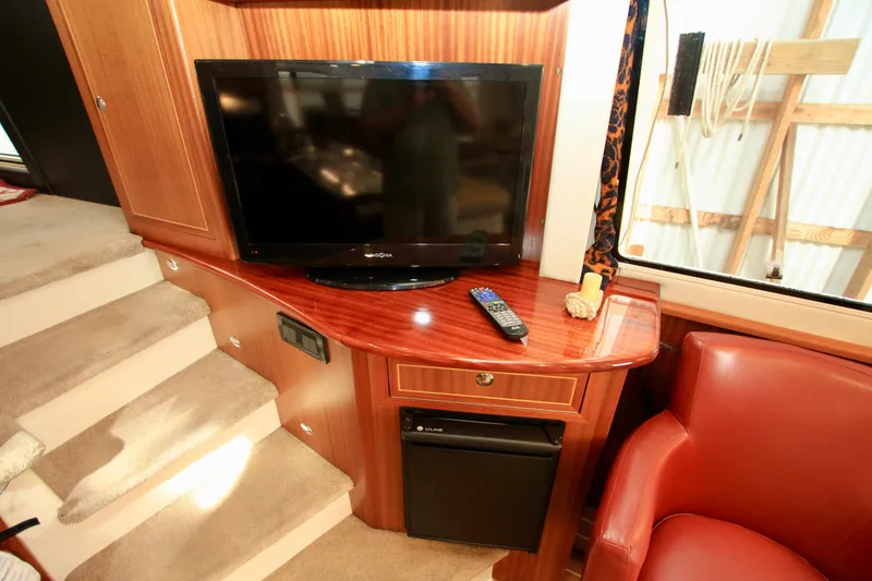 Slide: The Image of Interior of 2011 Fathom Element 43 with TV, remote, and red chair. - 27
