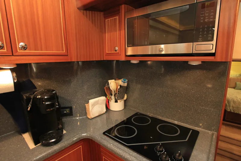 Slide: The Image of Compact kitchen in 2011 Fathom Element 43 with microwave, stovetop, and coffee maker. - 30