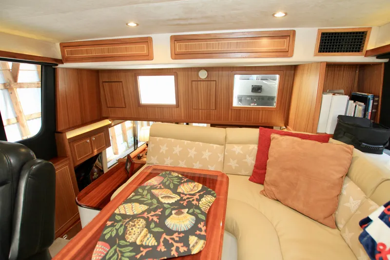 Slide: The Image of Luxurious interior of 2011 Fathom Element 43 yacht with wood paneling and cozy seating. - 37