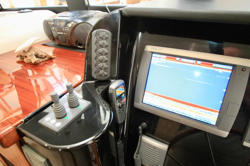 Slide: The Image of Control panel and display screen on 2011 Fathom Element 43 yacht interior. - 41