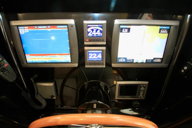 Slide: The Image of Boat dashboard with navigation screens and controls, Fathom Element 43, 2011 model. - 42