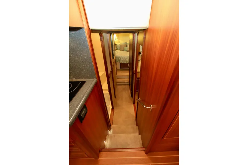 Slide: The Image of Interior view of 2011 Fathom Element 43 yacht, featuring a cozy cabin entrance. - 44