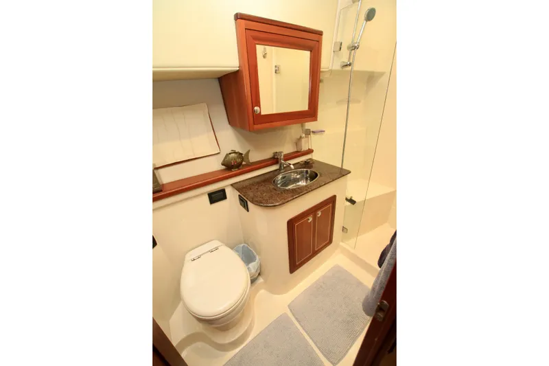 Slide: The Image of Luxurious bathroom in 2011 Fathom Element 43 yacht with modern fixtures and elegant design. - 45