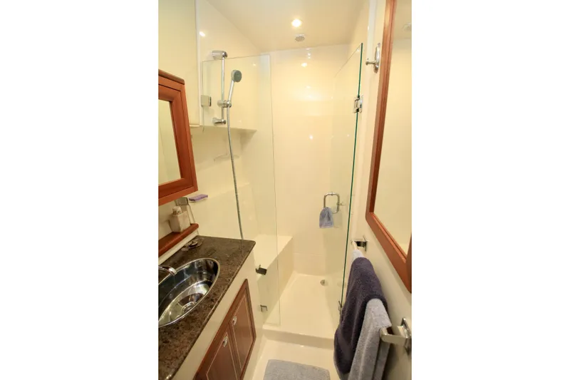 Slide: The Image of Compact bathroom with glass shower in 2011 Fathom Element 43 yacht. - 46