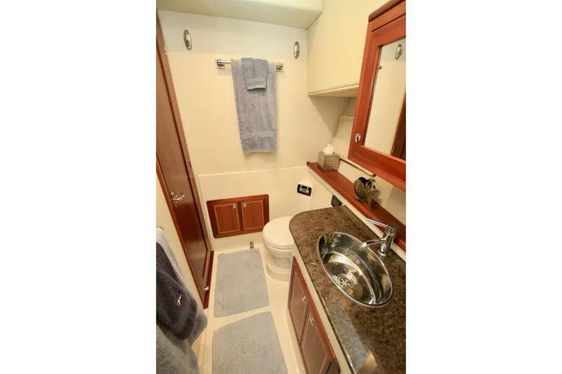 Slide: The Image of Luxurious bathroom in 2011 Fathom Element 43 yacht with modern fixtures and elegant design. - 47