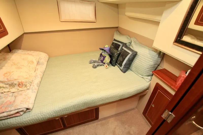 Slide: The Image of Cozy cabin bedroom in 2011 Fathom Element 43 yacht with plush bedding and decor. - 49