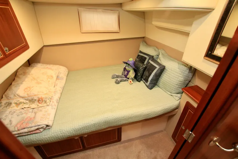 Slide: The Image of Cozy cabin bedroom in 2011 Fathom Element 43 yacht with plush bedding and decor. - 50