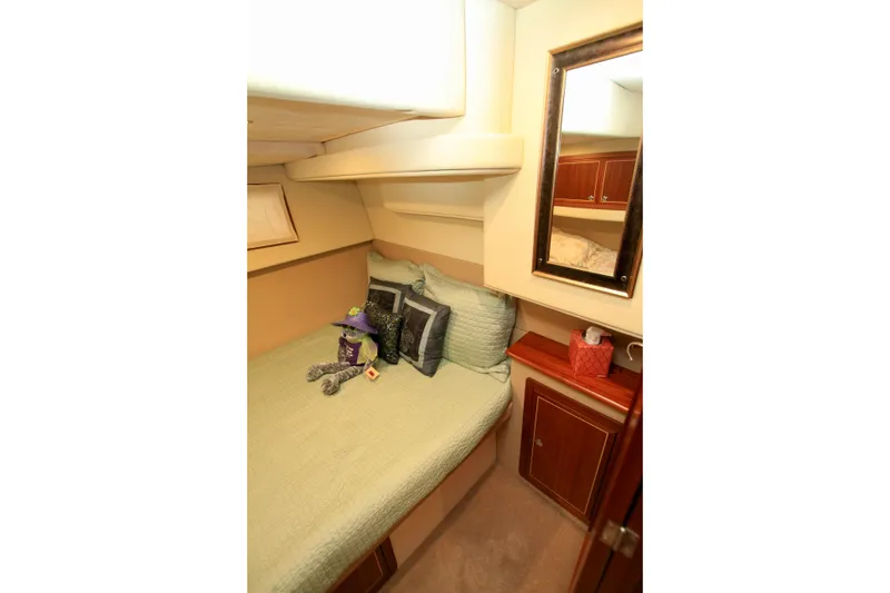 Slide: The Image of Cozy cabin interior of 2011 Fathom Element 43 yacht with bed and mirror. - 52
