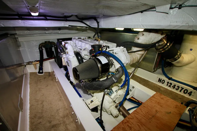 Slide: The Image of Engine room of 2011 Fathom Element 43 yacht, showcasing mechanical components and piping. - 63