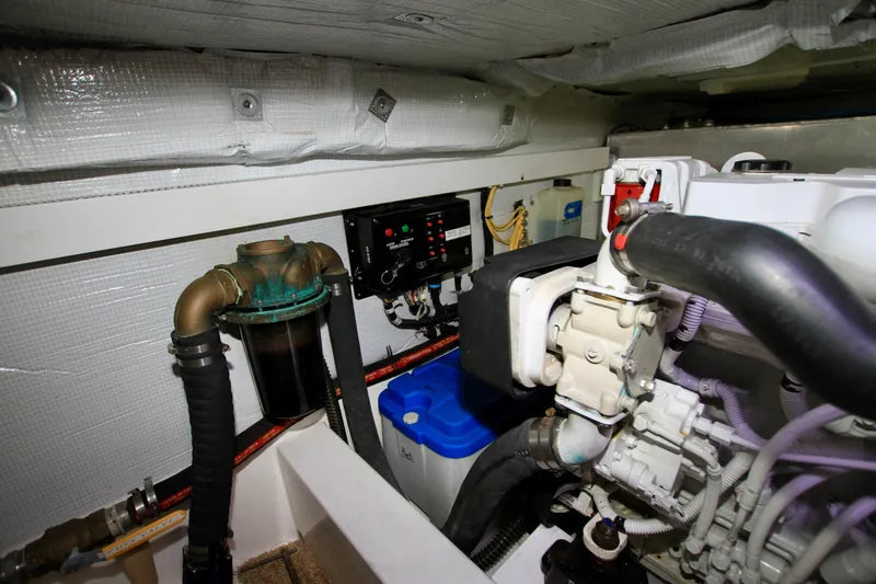 Slide: The Image of Engine room of 2011 Fathom Element 43 with mechanical components and control panel. - 67