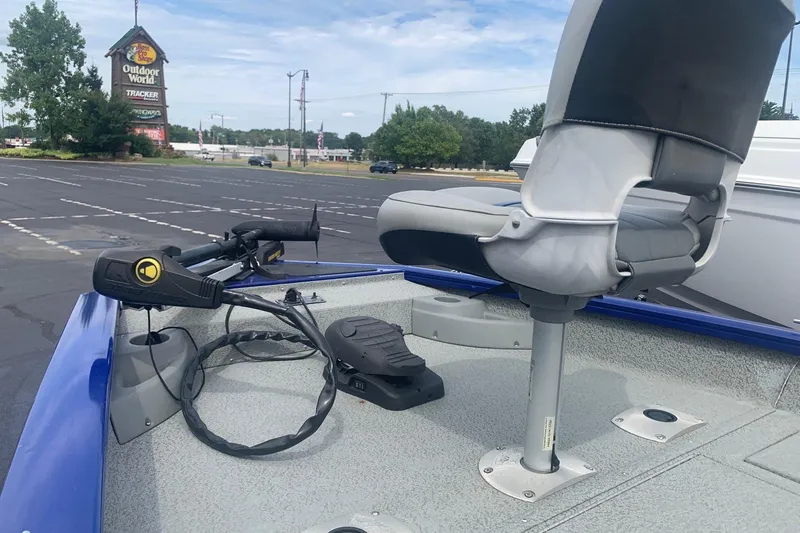 Slide: The Image of 2017 Tracker Pro Team 175 TF boat with seating and trolling motor in parking lot. - 5