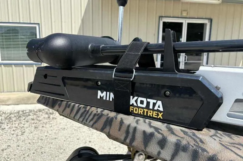 Slide: The Image of Minn Kota Fortrex trolling motor on 2024 Xpress XP200 Catfish boat, outdoor setting. - 7