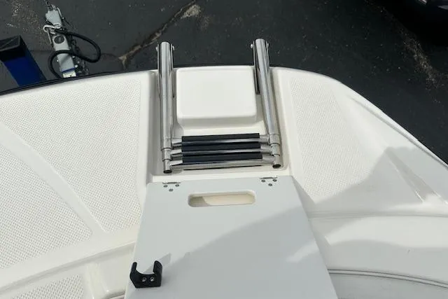Slide: The Image of 2006 Bayliner 217 Deck Boat swim platform with retractable ladder. - 13