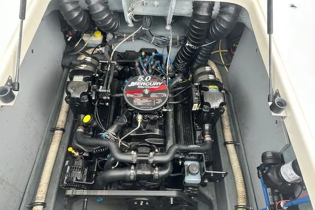 Slide: The Image of Engine compartment of a 2006 Bayliner 217 Deck Boat with 5.0 Mercury engine. - 20