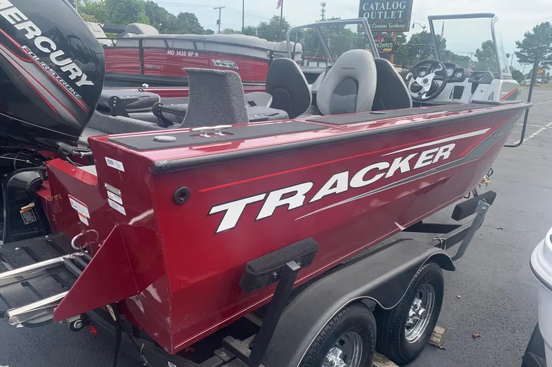 Slide: The Image of 2018 Tracker Targa V-18 Combo boat with Mercury engine, parked on a trailer. - 3