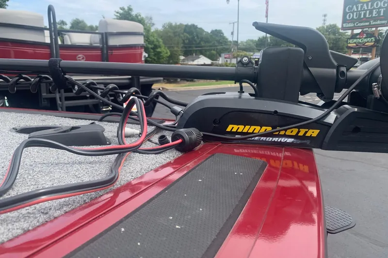 Slide: The Image of 2018 Tracker Targa V-18 Combo with Minn Kota PowerDrive trolling motor on red deck. - 6