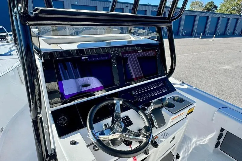 Slide: The Image of 2024 Blazer Bay 2700 Hybrid Bay boat dashboard with advanced navigation systems. - 4