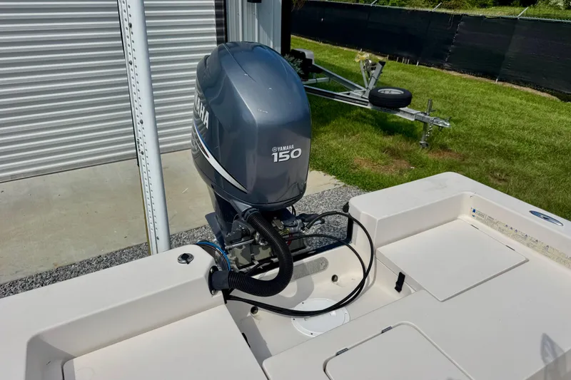 Slide: The Image of 2004 Pathfinder 2200-V boat with Yamaha 150 outboard motor in storage area. - 8