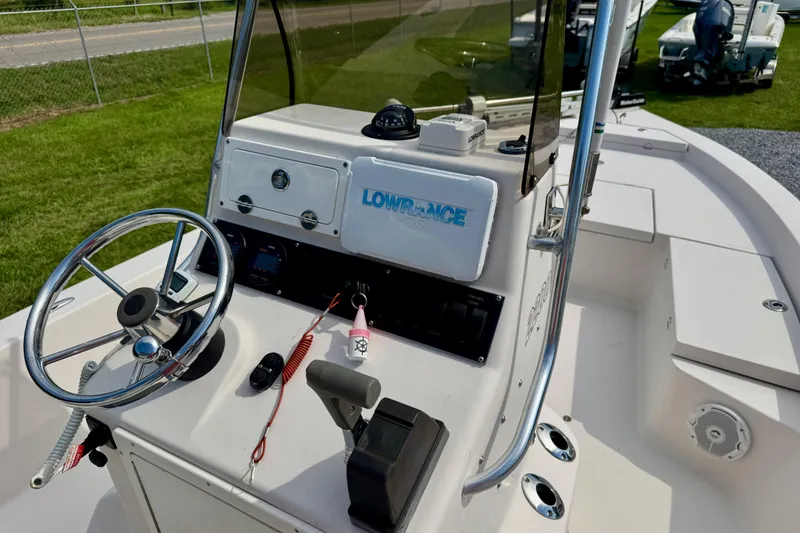 Slide: The Image of 2004 Pathfinder 2200-V boat console with steering wheel and navigation equipment. - 9