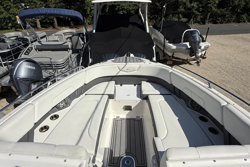 Slide: The Image of 2016 Chaparral 307 SSX boat interior with spacious seating and cup holders. - 13