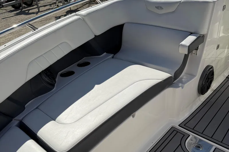 Slide: The Image of Luxurious seating on 2016 Chaparral 307 SSX boat with cup holders and speaker. - 16