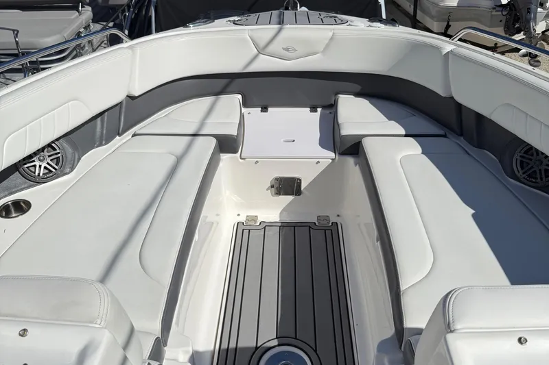 Slide: The Image of 2016 Chaparral 307 SSX boat interior with white seating and modern design. - 20