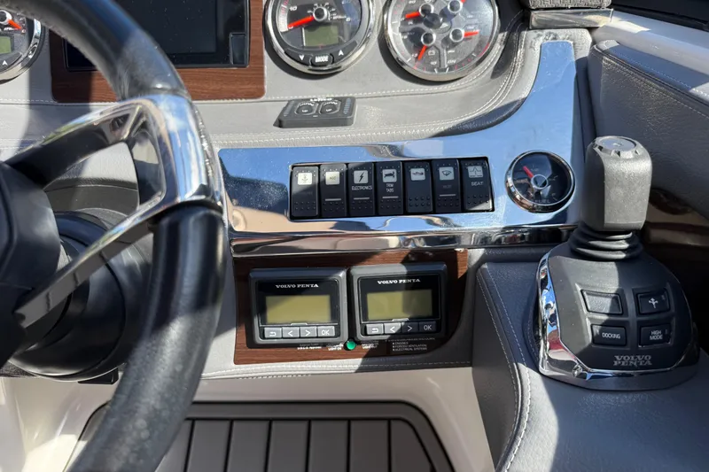 Slide: The Image of 2016 Chaparral 307 SSX dashboard with steering wheel, controls, and Volvo Penta display. - 31