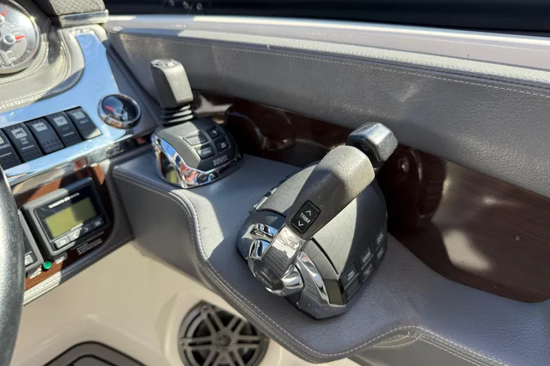 Slide: The Image of Control panel of 2016 Chaparral 307 SSX boat with throttle and gauges. - 32