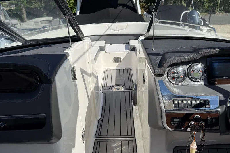 Slide: The Image of 2016 Chaparral 307 SSX boat interior with sleek dashboard and modern controls. - 33
